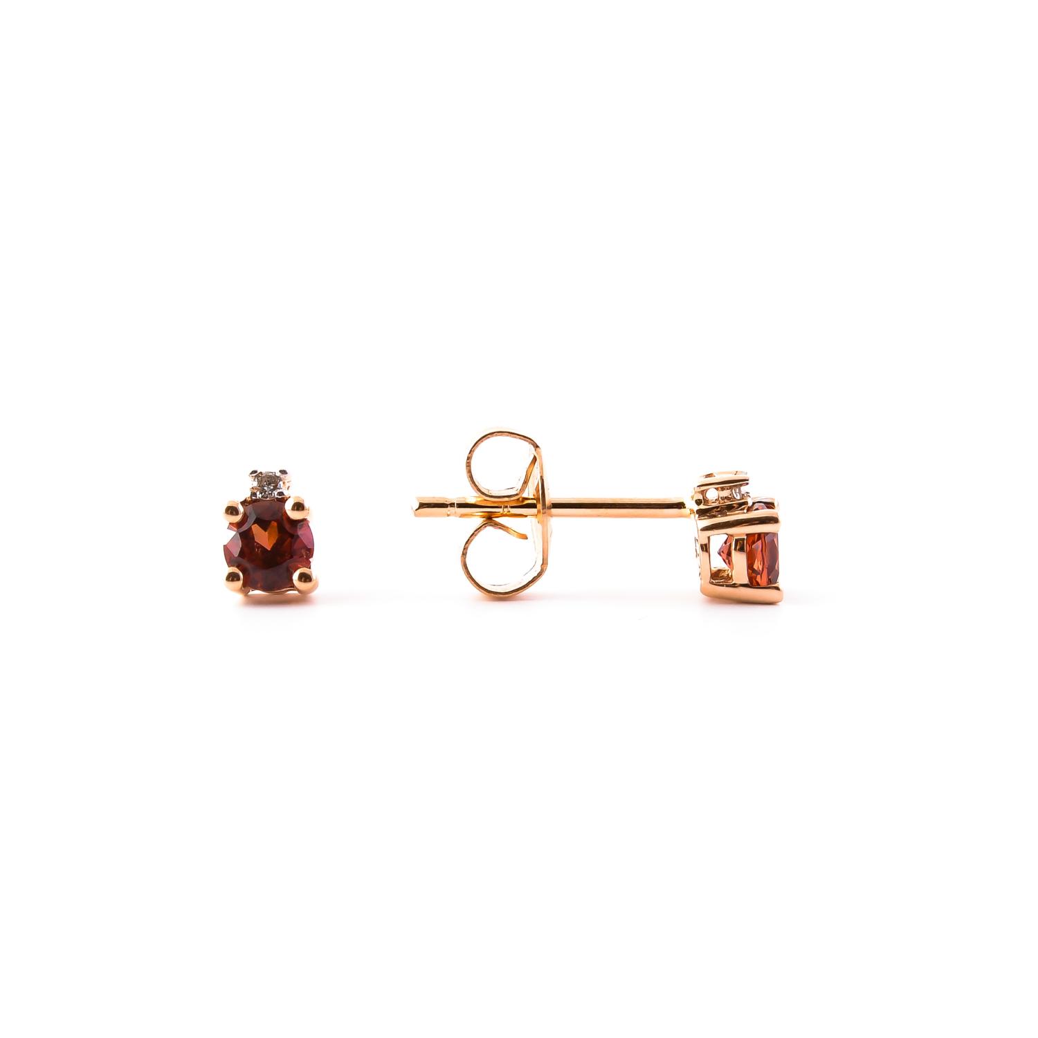 Gold earrings with garnet and diamond