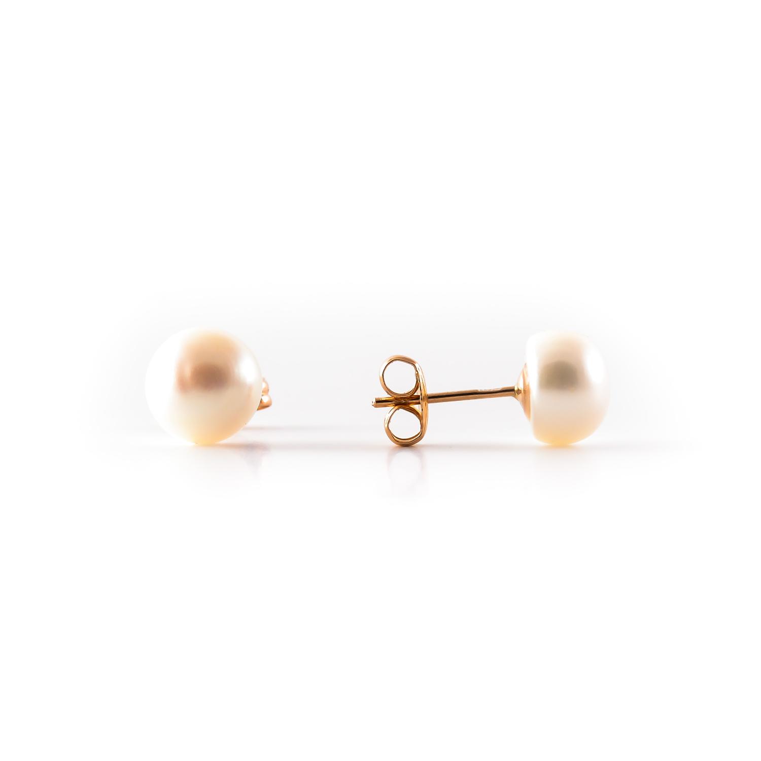 Gold stud earrings with pearl